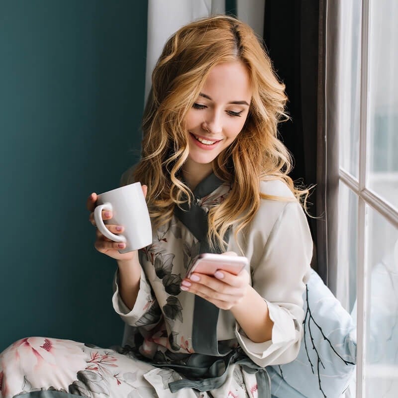Woman Looking at Mobile Phone